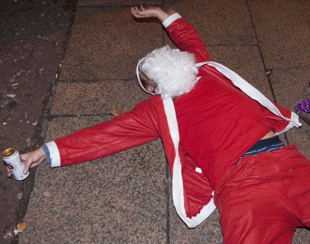 drunk-santa-lying-on-the-ground-stock-image